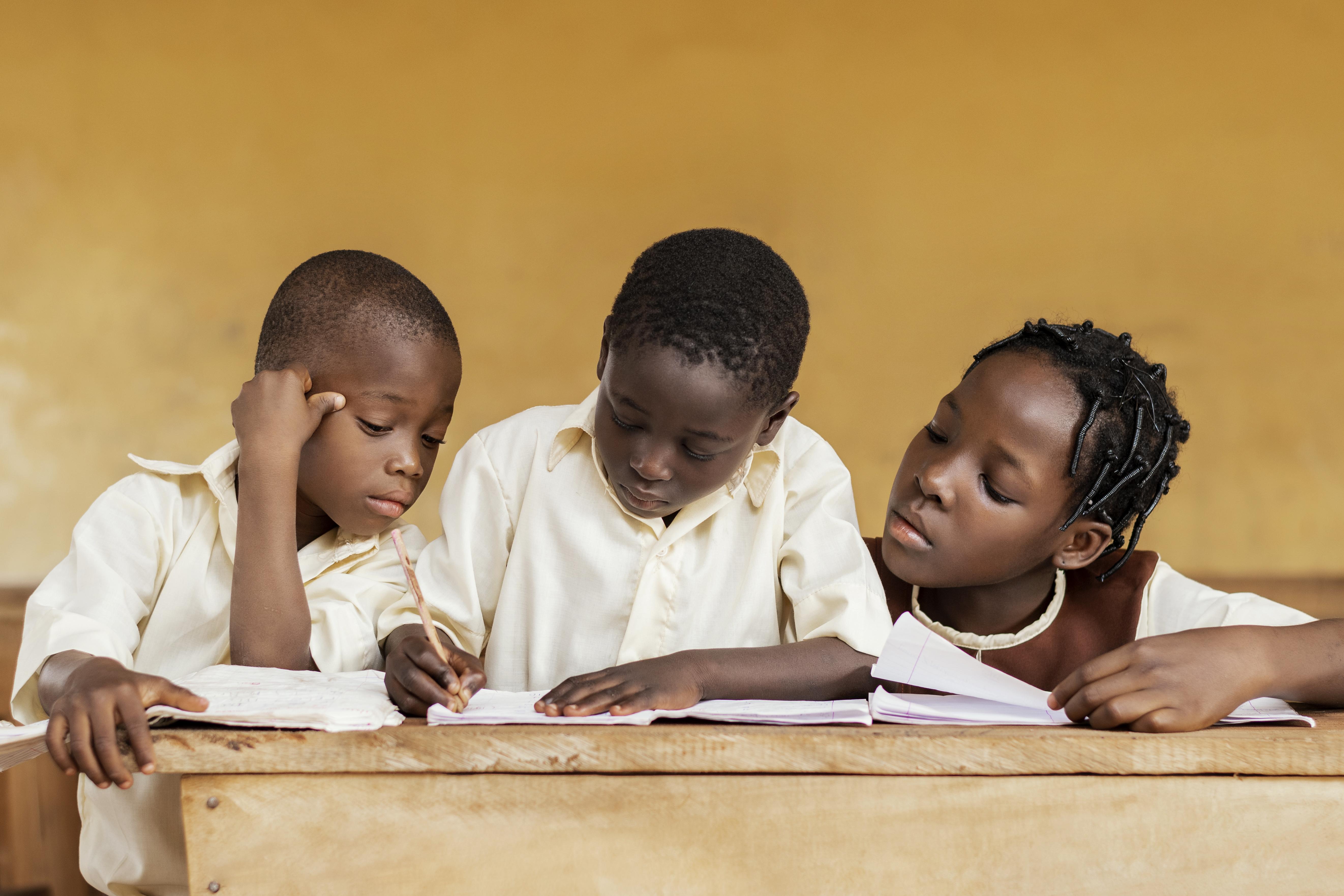 Group of African kids learning together
