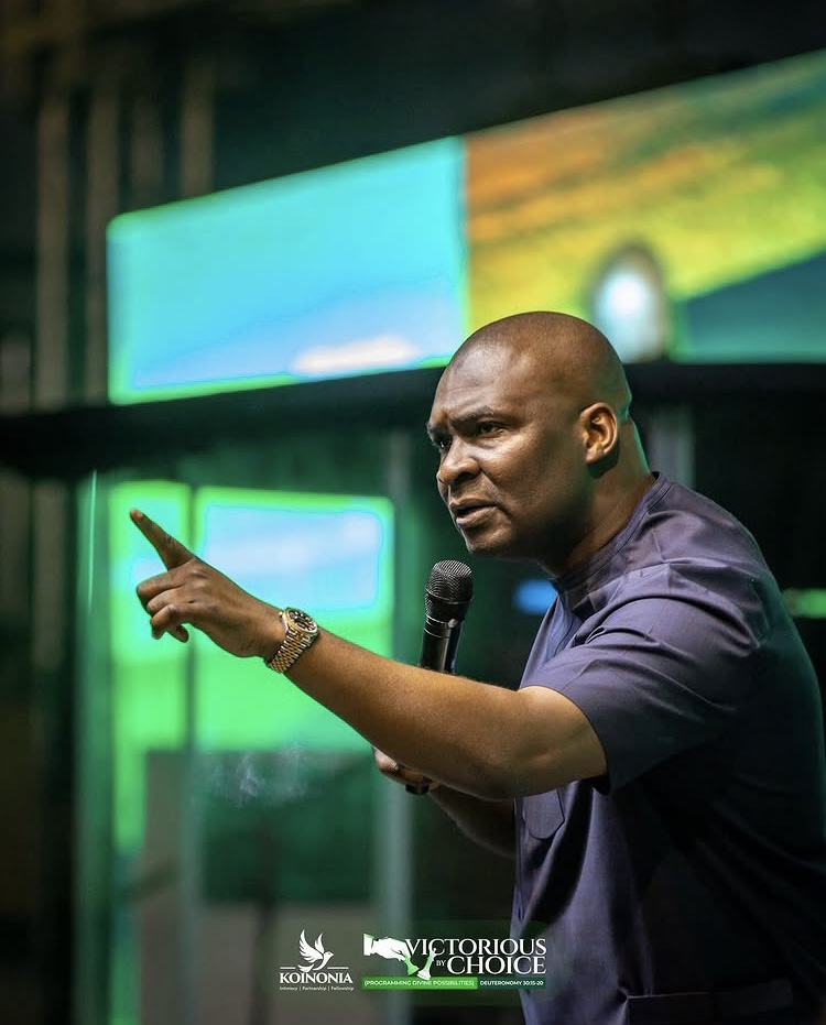 Apostle Joshua smiling on stage