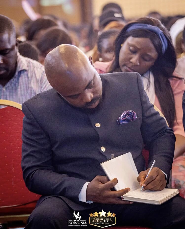 Minister taking notes